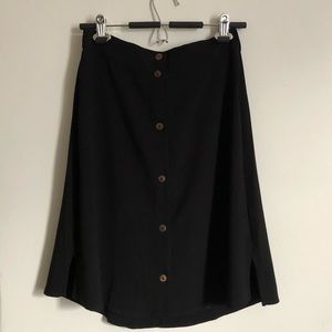 Knee length black skirt with buttons